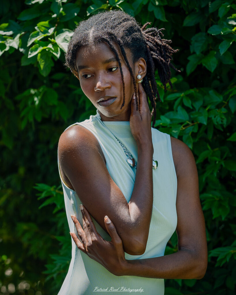 Natural light portrait of a model, photographed on June 28, 2025. She is posed outdoors with soft, flattering lighting, conveying a calm and confident expression.